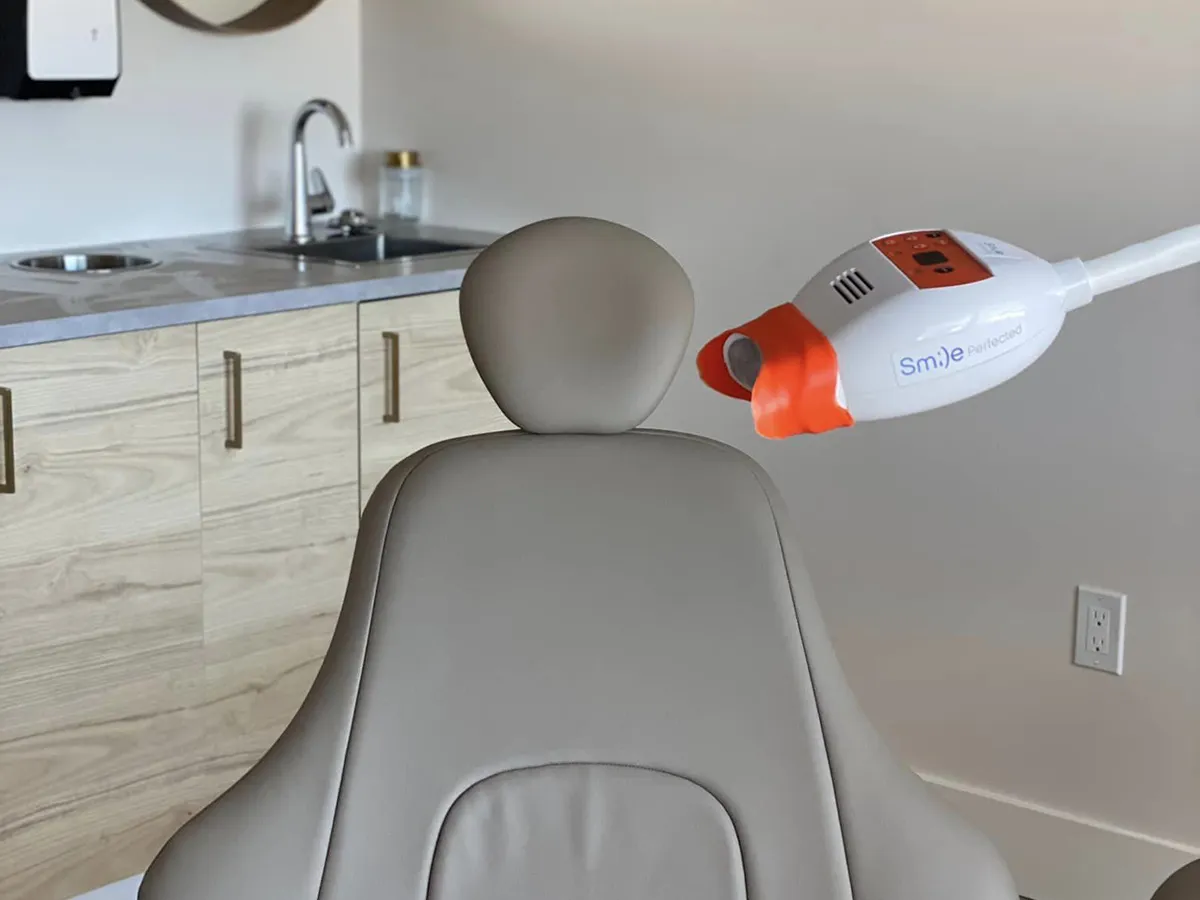 Photo of dental chair and teeth whitening equipment